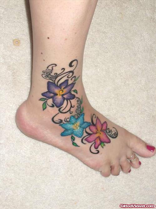 Colored Flowers Tattoos On Girl Right Foot