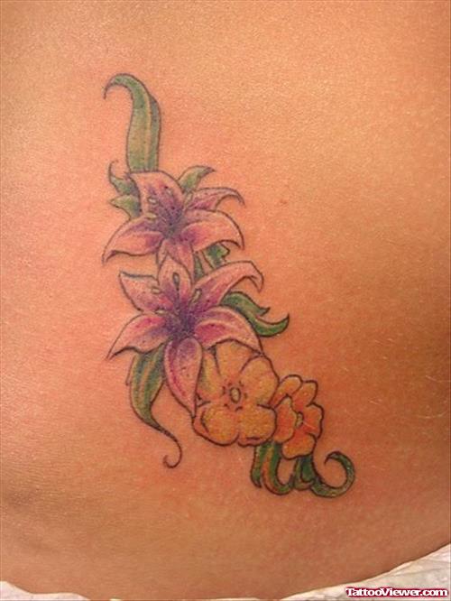 Color Tribal And Flowers Tattoos On Hip