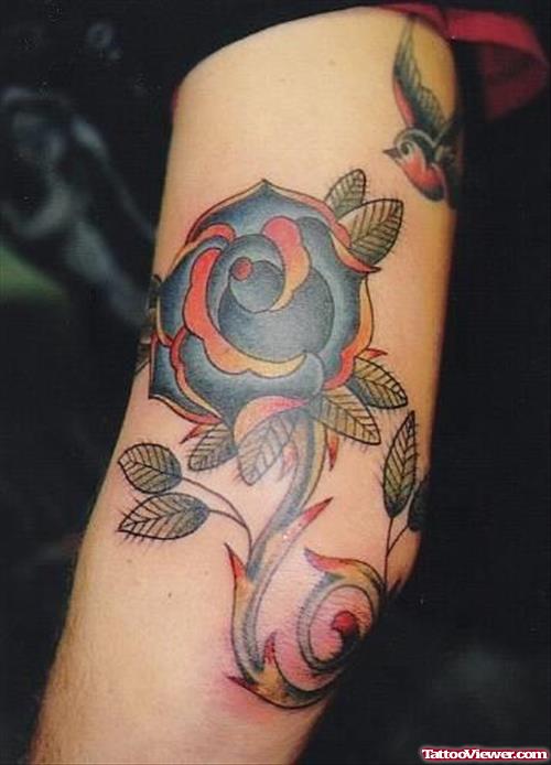 Blue Flower Tattoo On Left Sleeve