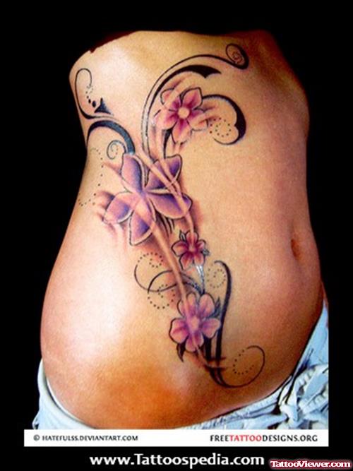 Awesome Tribal And Flower Tattoo On Side