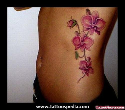 Orchif Flower Tattoo On Rib Side