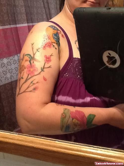 Color Flowers And Bird Tattoo On Half Sleeve