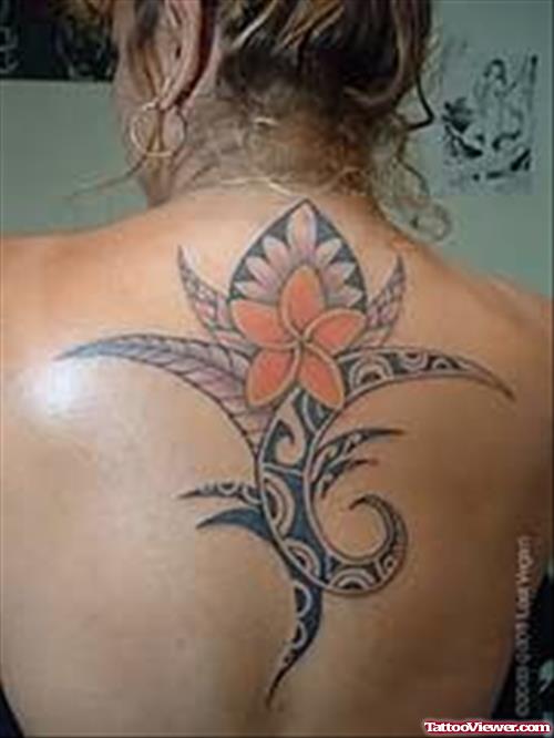 Girl Showing Flower Tattoo On Back