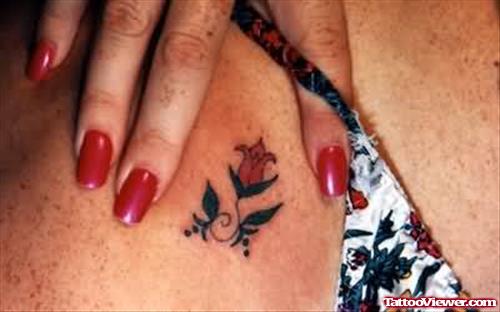 Girl Showing Little Flower Tattoo
