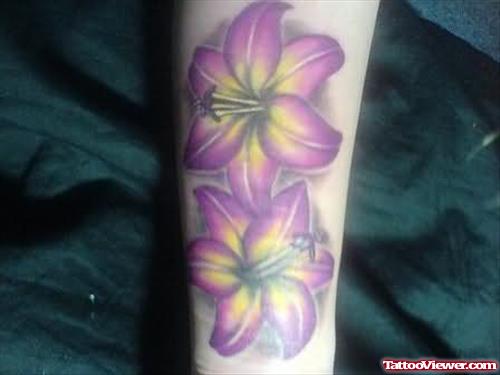 Purple Lily Flower Tattoo On Arm