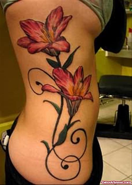 Lily Pink Tattoo On Side Rib