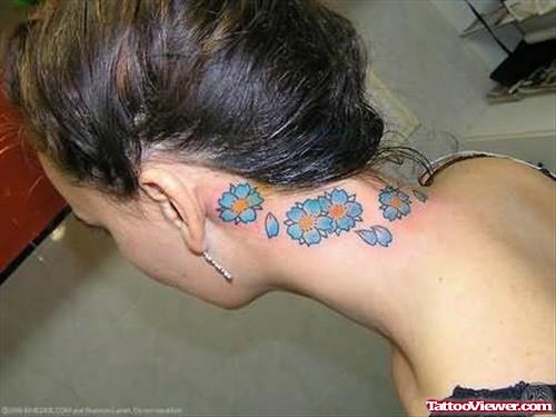 Blue Flowers Tattoo On Neck