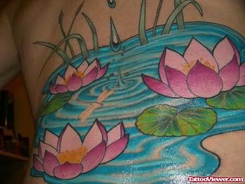 Lotus In Pond Tattoo On Back