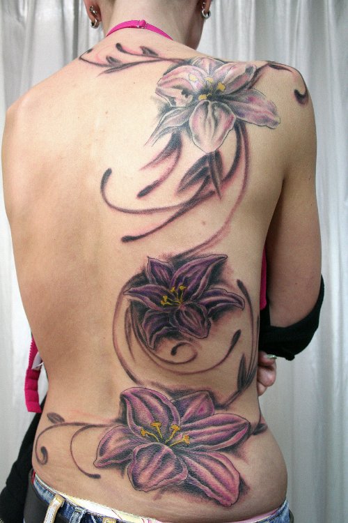 Beautiful Tribal And Flower Tattoos On Back