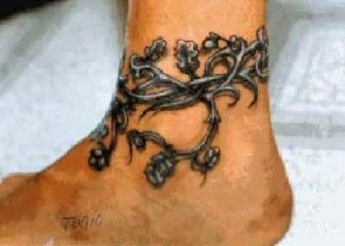 Flower Tattoo Around The Foot