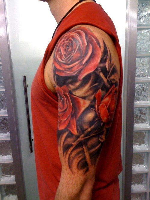 Red Roses And Tribal Flower Tattoo On Half Sleeve