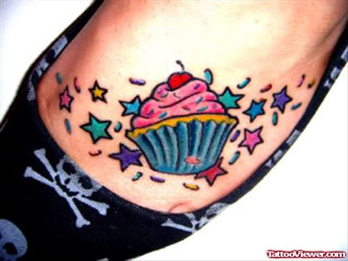 Colored Stars And Cup Cake Foot Tattoo