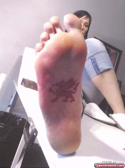 Red Ink Dragon Tattoo Under Foot