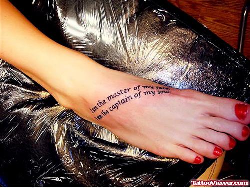 Girl With Lettering Tattoo On Right Foot