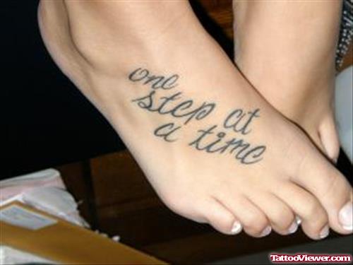 Girl showing Her Quote Foot Tattoo