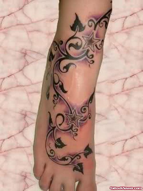 Cool Stars And Black Leaves Foot Tattoo
