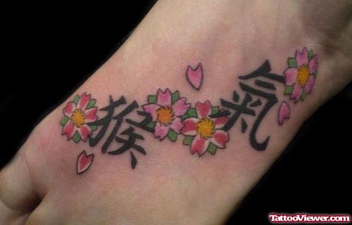 Chinese Symbols And Cherry Blossom Flowers Foot Tattoo