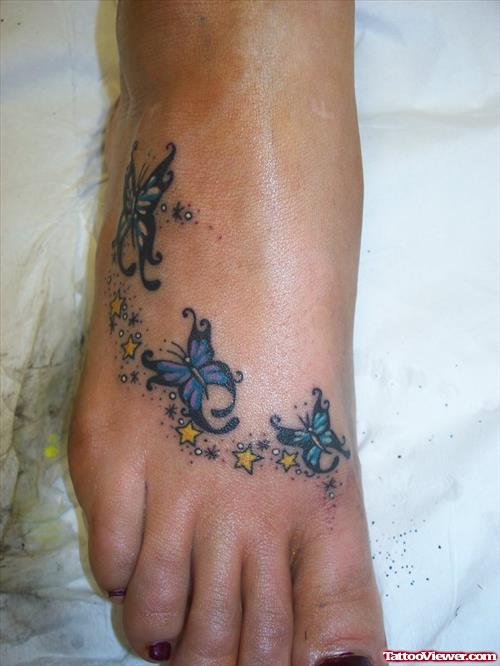 Yellow Stars And Butterflies Foot Tattoos