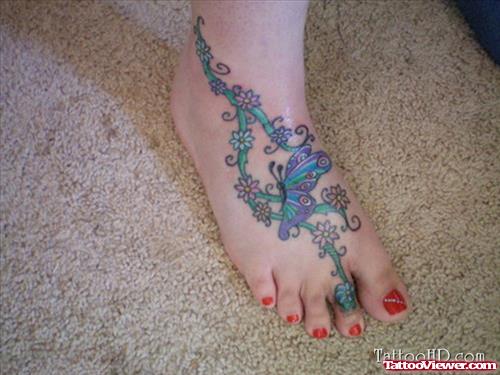 Colored Flowers And Butterfly Foot Tattoo