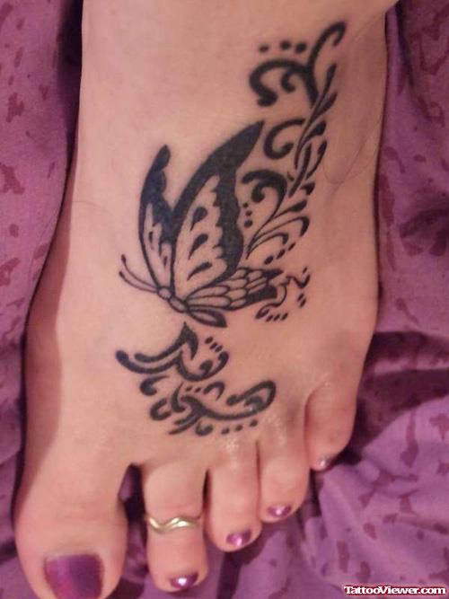 Black Ink Butterfly Tattoo On Girl Left Foot