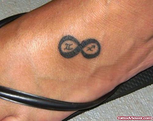 Zodiac and Infinity Symbol Foot Tattoo