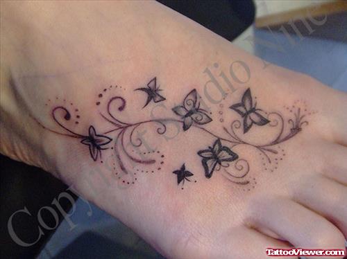 Amazing Grey Ink Butterflies Foot Tattoo