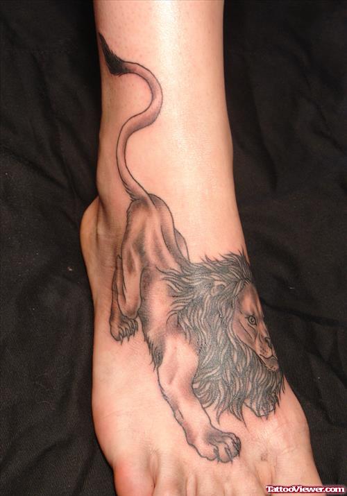 Grey Ink Lion Tattoo On Right Foot