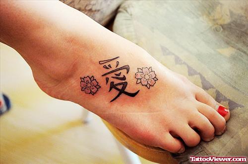 Chinese Symbol And Flowers Foot Tattoo