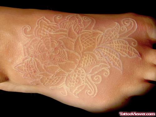 White Ink Flowers Foot Tattoo