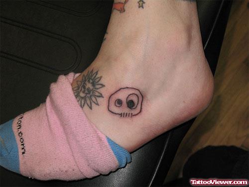Flower And Skull Foot Tattoo
