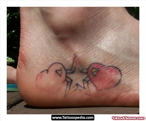 Pink Hearts And Star Tattoo On Foot