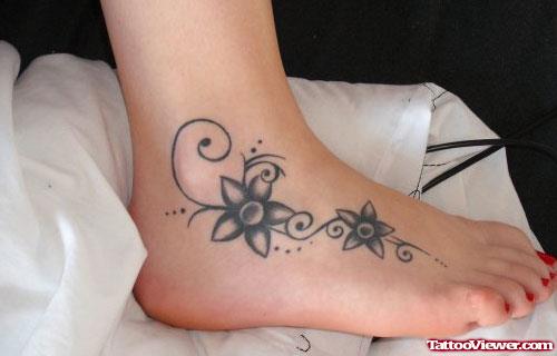 Awesome Grey Ink Flowers Foot Tattoo