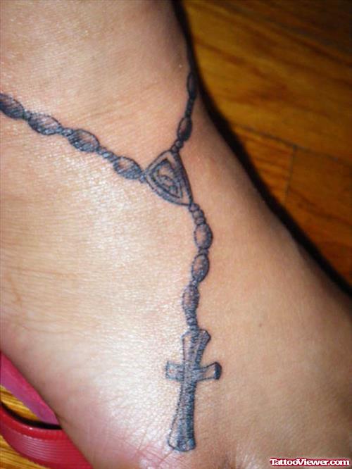 Grey Ink Rosary Cross Foot Tattoo