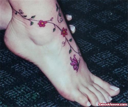 Girl With Flowers And Butterfly Foot Tattoo