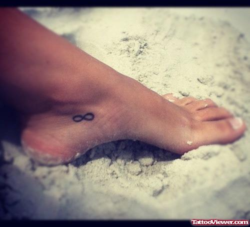 Black Ink Infinity Symbol Foot Tattoo