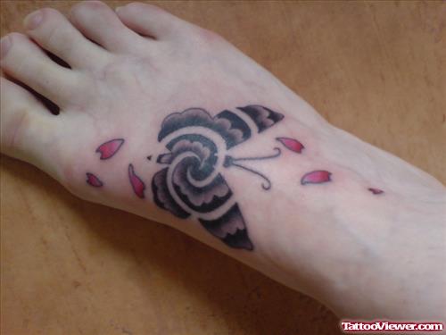 Awesome Grey Ink Spiral Butterfly Tattoo On Right Foot