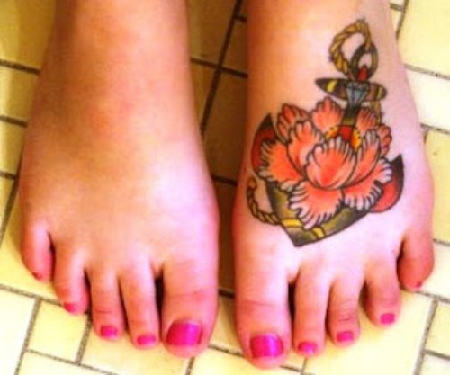 Anchor And Flower Tattoo On Girl Left Foot
