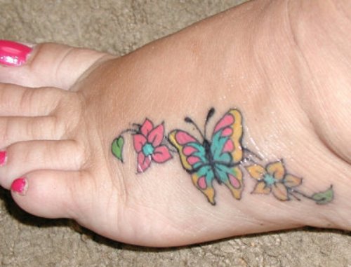 Beautiful Colored Flowers And Butterfly Foot Tattoo