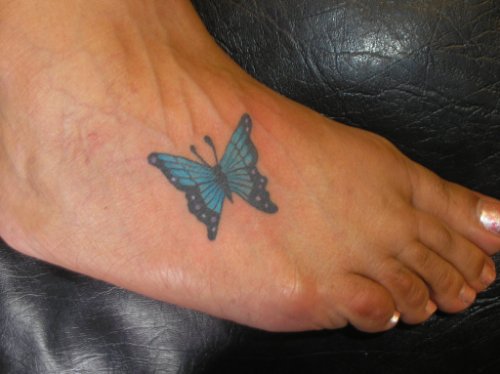Blue Ink Butterfly Tattoo On Foot