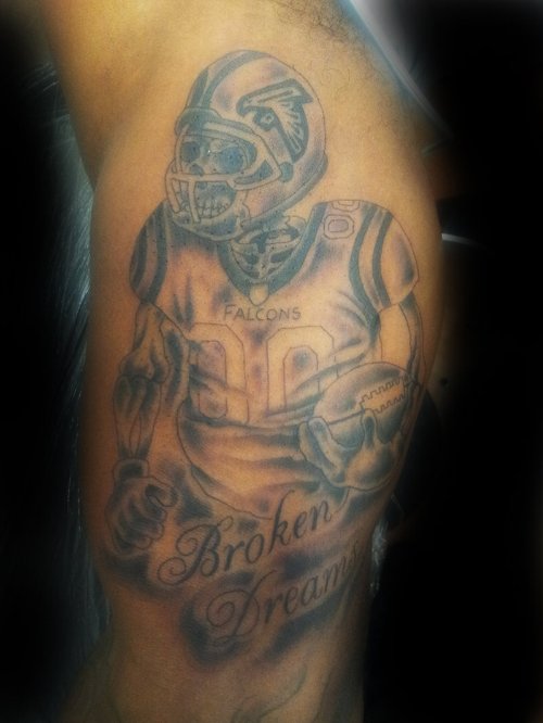 Grey Ink American Football Player Tattoo