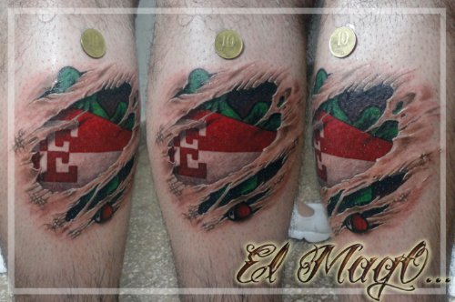 Ripped Skin Football Tattoo On Leg
