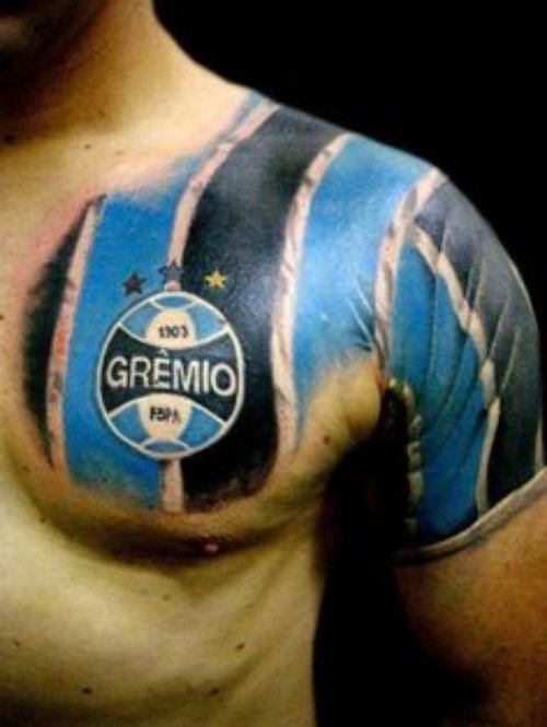 Blue And Black Ink Football Tattoo On chest And Left Shoulder