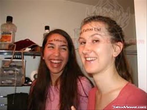Smiling Girls Have Forehead Tattoo