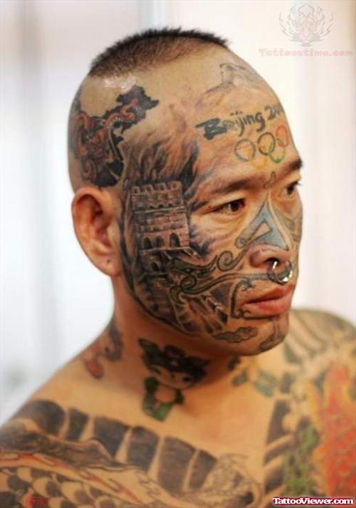 Face And Beijing Tattoo On Forehead