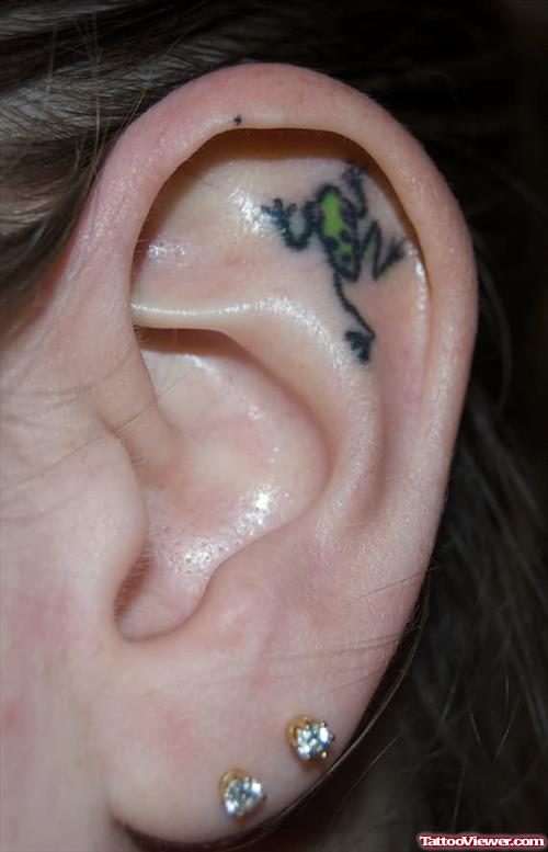 Frog Tattoo In Ear Of A Girl