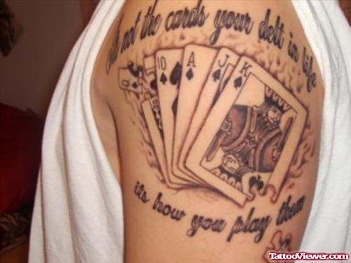 Grey Ink Flaming Cards Tattoo On Left Shoulder