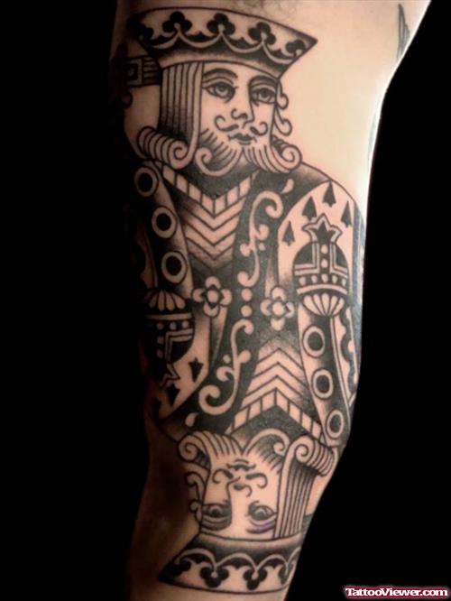 Grey Ink Card King Gambling Tattoo On Arm