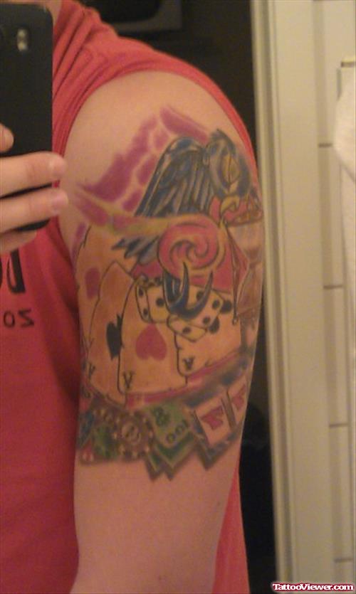 Colored Cards And Dice Gambling Tattoo On Left Sleeve