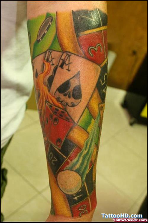 Cards And Flaming Dice Gambling Tattoo On Arm