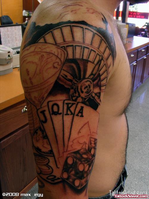 Grey Ink Cards And Dice Gambling Tattoo on Right Arm